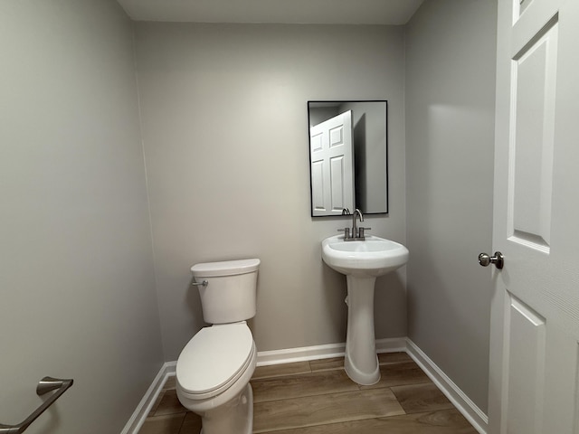 9424 Fuller Rd, Chattanooga, TN 37421 - bathroom featuring toilet and wood finished floors