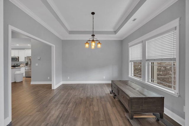 386 Twelve Oaks Dr, Rock Spring, GA 30739 - empty room featuring a chandelier, a tray ceiling, dark wood-style flooring, and ornamental molding