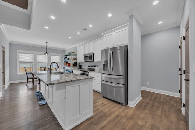 386 Twelve Oaks Dr, Rock Spring, GA 30739 - kitchen with appliances with stainless steel finishes, crown molding, white cabinetry, a center island with sink, and recessed lighting