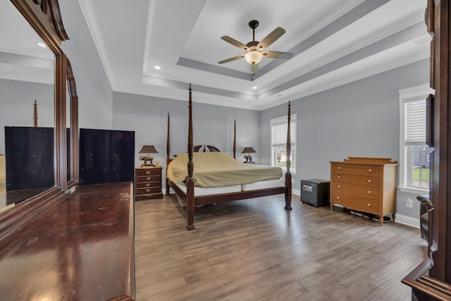 386 Twelve Oaks Dr, Rock Spring, GA 30739 - bedroom featuring a tray ceiling, wood finished floors, crown molding, recessed lighting, and ceiling fan