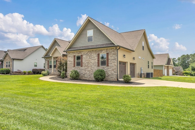 386 Twelve Oaks Dr, Rock Spring, GA 30739 - craftsman inspired home featuring a garage, concrete driveway, brick siding, and a front lawn