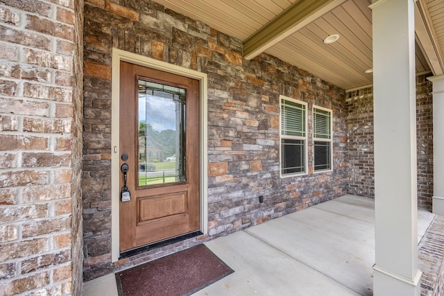 386 Twelve Oaks Dr, Rock Spring, GA 30739 - doorway to property with stone siding, covered porch, and brick siding