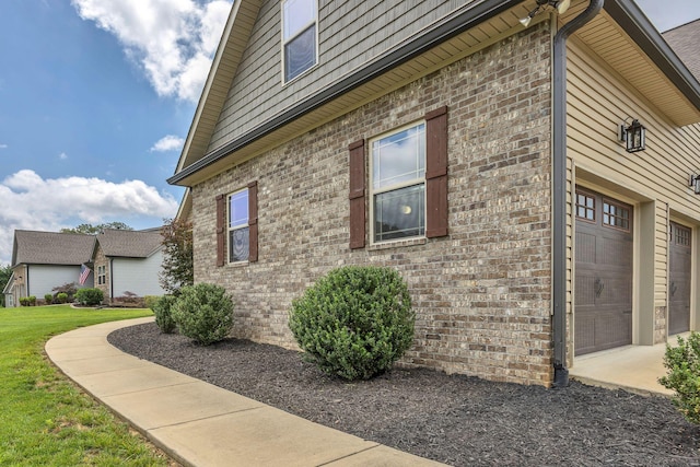 386 Twelve Oaks Dr, Rock Spring, GA 30739 - view of side of property featuring brick siding, driveway, and a yard