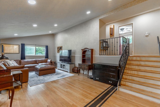1027 Crestridge Dr, Rossville, GA 30741 - living room featuring wood finished floors, recessed lighting, stairs, and vaulted ceiling