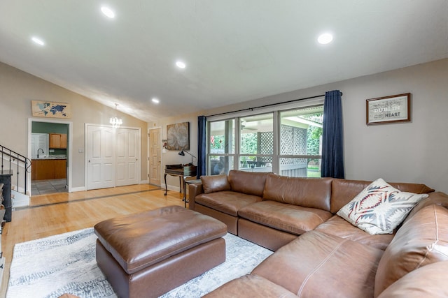 1027 Crestridge Dr, Rossville, GA 30741 - living room featuring light wood-style flooring, recessed lighting, lofted ceiling, and stairway