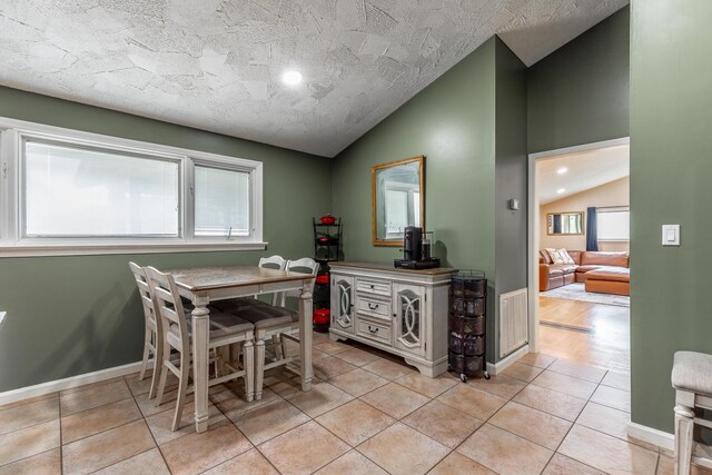 1027 Crestridge Dr, Rossville, GA 30741 - dining room with vaulted ceiling, recessed lighting, light tile patterned floors, and a textured ceiling