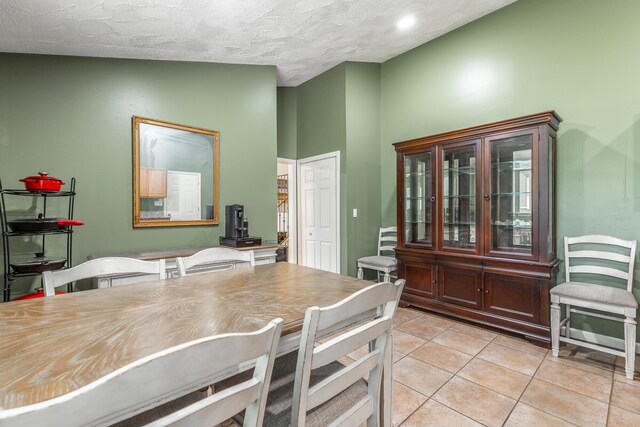 1027 Crestridge Dr, Rossville, GA 30741 - dining room featuring light tile patterned floors and a textured ceiling