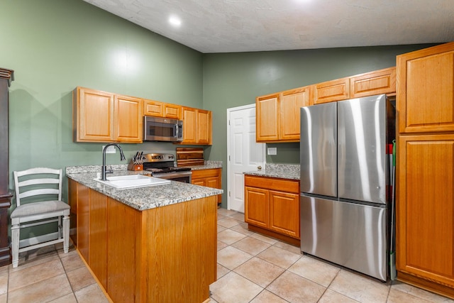 1027 Crestridge Dr, Rossville, GA 30741 - kitchen featuring appliances with stainless steel finishes, high vaulted ceiling, a peninsula, and light tile patterned flooring