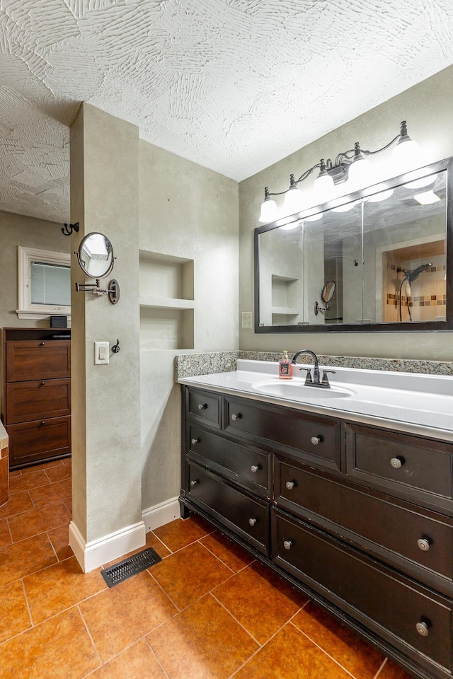 1027 Crestridge Dr, Rossville, GA 30741 - bathroom featuring vanity, a textured ceiling, and tile patterned floors