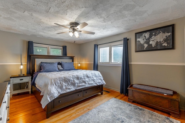 1027 Crestridge Dr, Rossville, GA 30741 - bedroom featuring wood finished floors, a ceiling fan, and a textured ceiling