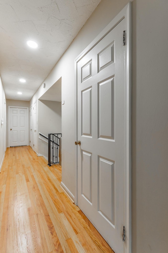1027 Crestridge Dr, Rossville, GA 30741 - corridor with light wood finished floors, an upstairs landing, and recessed lighting