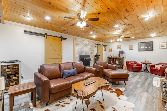 1027 Crestridge Dr, Rossville, GA 30741 - living room featuring a barn door, ceiling fan, ornamental molding, light wood-style flooring, and recessed lighting