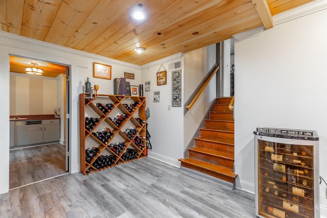 1027 Crestridge Dr, Rossville, GA 30741 - wine room with beverage cooler, wood finished floors, wood ceiling, crown molding, and recessed lighting