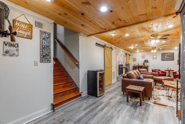 1027 Crestridge Dr, Rossville, GA 30741 - living room with a barn door, wood finished floors, recessed lighting, wood ceiling, and stairway