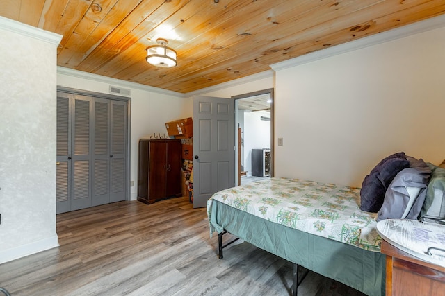 1027 Crestridge Dr, Rossville, GA 30741 - bedroom featuring ornamental molding, a closet, wood finished floors, and wooden ceiling