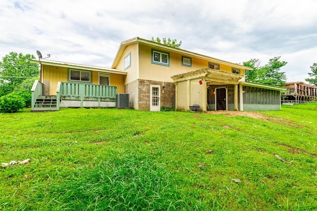 1027 Crestridge Dr, Rossville, GA 30741 - rear view of house with a sunroom, a yard, and a deck