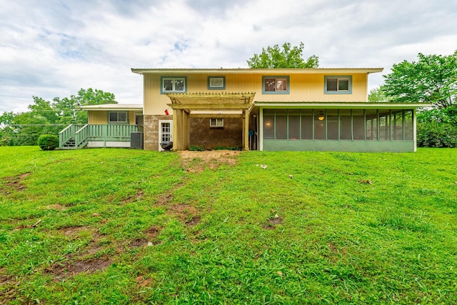 1027 Crestridge Dr, Rossville, GA 30741 - back of property with a sunroom, a deck, a lawn, and a pergola