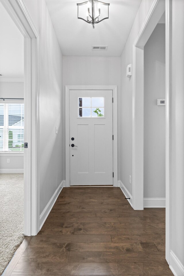 3480 Travertine Ln, Chattanooga, TN 37405 - foyer entrance featuring dark wood finished floors and a chandelier