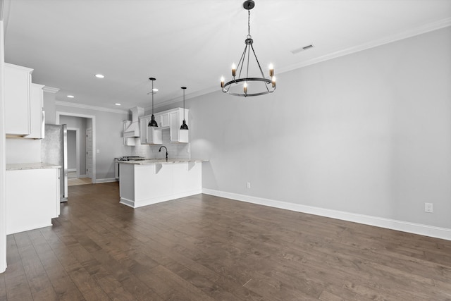 3480 Travertine Ln, Chattanooga, TN 37405 - kitchen featuring premium range hood, a chandelier, a peninsula, white cabinets, and recessed lighting