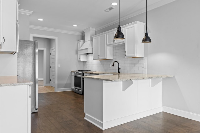 3480 Travertine Ln, Chattanooga, TN 37405 - kitchen featuring stainless steel appliances, a peninsula, crown molding, light stone countertops, and custom exhaust hood