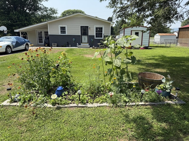 78 Mcdonough St, Dunlap, TN 37327 - view of yard with a storage unit, entry steps, and french doors