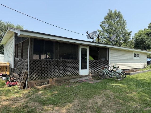 78 Mcdonough St, Dunlap, TN 37327 - rear view of house featuring a sunroom and a lawn