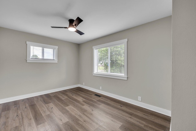 185 Block Rd, Rossville, GA 30741 - empty room featuring healthy amount of natural light, dark wood-style floors, and a ceiling fan