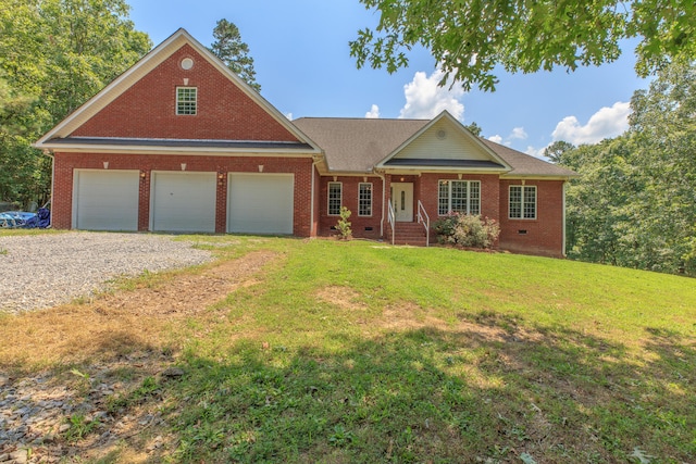 1103 Monroe Green Rd, Trion, GA 30753 - view of front of home with brick siding, driveway, a front lawn, and an attached garage