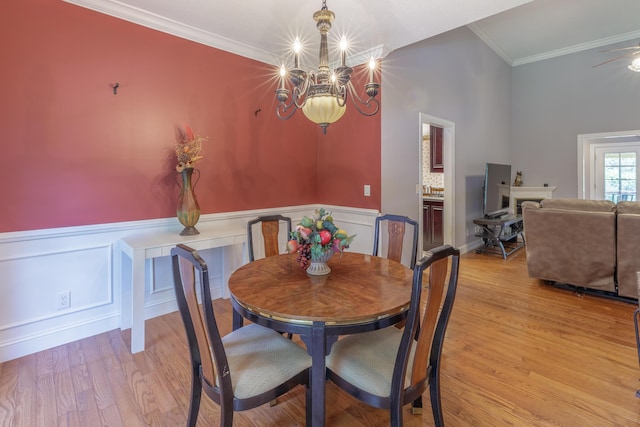 1103 Monroe Green Rd, Trion, GA 30753 - dining area with ornamental molding, a chandelier, light wood finished floors, a wainscoted wall, and a decorative wall