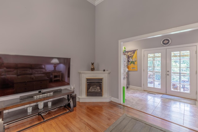 1103 Monroe Green Rd, Trion, GA 30753 - living room featuring french doors, crown molding, wood finished floors, and a glass covered fireplace