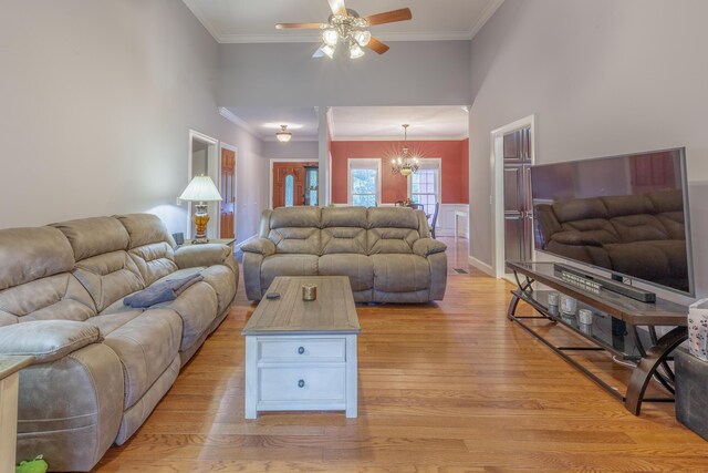 1103 Monroe Green Rd, Trion, GA 30753 - living area featuring light wood-style flooring, ceiling fan, crown molding, and a chandelier