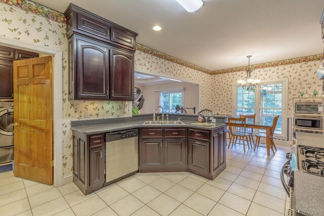 1103 Monroe Green Rd, Trion, GA 30753 - kitchen with stainless steel appliances, wallpapered walls, dark countertops, a chandelier, and light tile patterned flooring