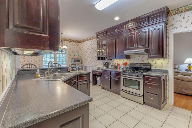 1103 Monroe Green Rd, Trion, GA 30753 - kitchen featuring wallpapered walls, stainless steel gas range oven, under cabinet range hood, a chandelier, and light tile patterned floors