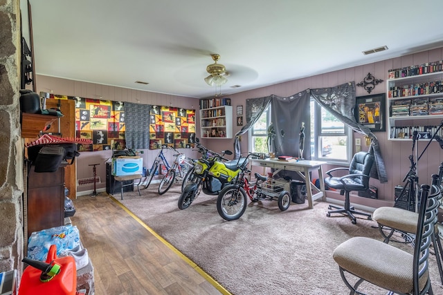 4433 Live Oak Ln, Chattanooga, TN 37411 - living room with wood finished floors, ceiling fan, and wood walls