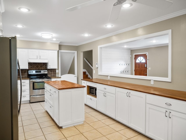 957 Elaine Trl, Chattanooga, TN 37421 - kitchen with wooden counters, appliances with stainless steel finishes, a ceiling fan, white cabinetry, and light tile patterned floors
