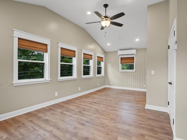 957 Elaine Trl, Chattanooga, TN 37421 - spare room featuring a wall unit AC, vaulted ceiling, ceiling fan, light wood-type flooring, and recessed lighting