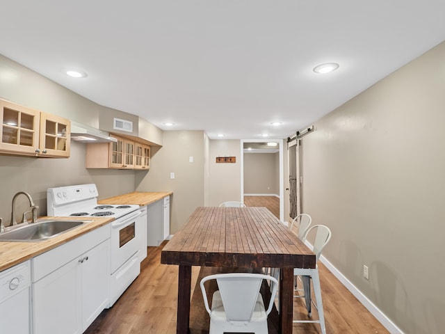 957 Elaine Trl, Chattanooga, TN 37421 - kitchen featuring white appliances, a barn door, wooden counters, light wood finished floors, and glass insert cabinets