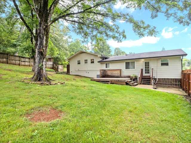 957 Elaine Trl, Chattanooga, TN 37421 - rear view of property with a fenced backyard and a wooden deck