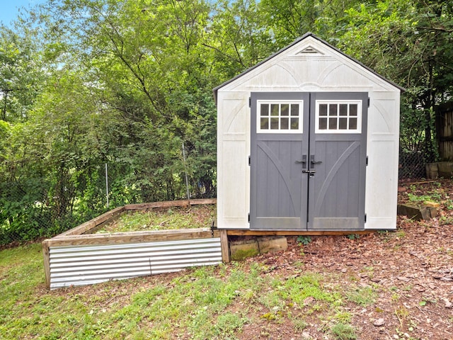 957 Elaine Trl, Chattanooga, TN 37421 - view of shed with a vegetable garden