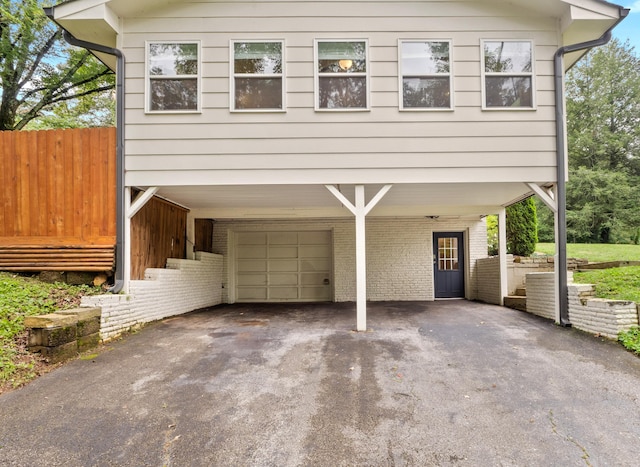 957 Elaine Trl, Chattanooga, TN 37421 - view of front of house with a carport, asphalt driveway, and brick siding