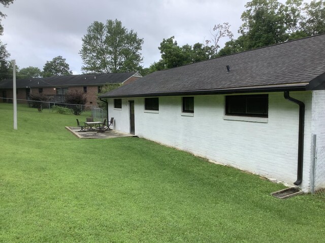 1322 Vance Rd, Chattanooga, TN 37421 - rear view of property with roof with shingles, a patio, and brick siding