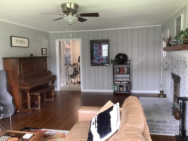 1322 Vance Rd, Chattanooga, TN 37421 - living room featuring wood finished floors, a ceiling fan, crown molding, and a brick fireplace