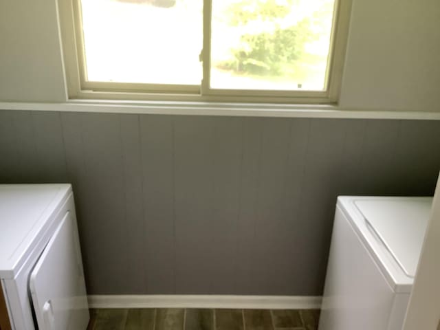 1322 Vance Rd, Chattanooga, TN 37421 - laundry area with plenty of natural light, washer and dryer, a wainscoted wall, and cabinet space