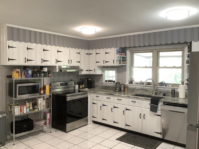 1322 Vance Rd, Chattanooga, TN 37421 - kitchen featuring stainless steel appliances, under cabinet range hood, light tile patterned floors, white cabinetry, and crown molding