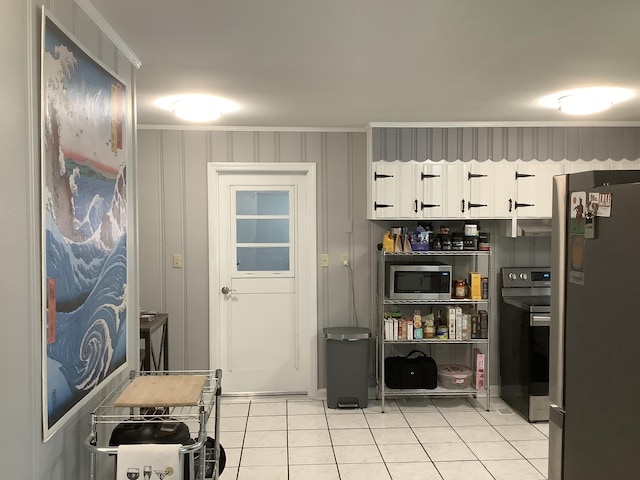 1322 Vance Rd, Chattanooga, TN 37421 - kitchen with stainless steel appliances, ornamental molding, white cabinetry, and light tile patterned flooring