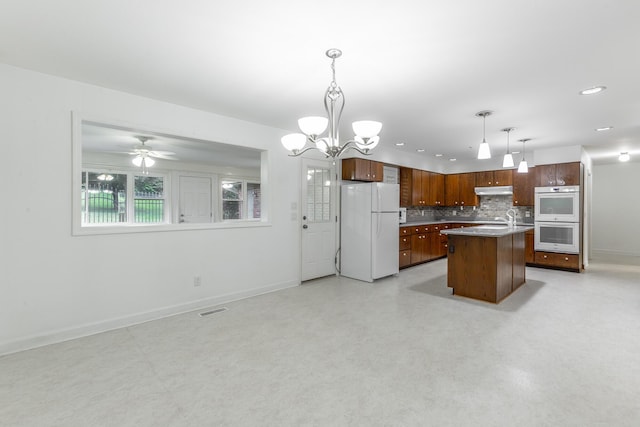 2046 N Concord Rd, Chattanooga, TN 37421 - kitchen featuring white appliances, under cabinet range hood, open floor plan, backsplash, and recessed lighting