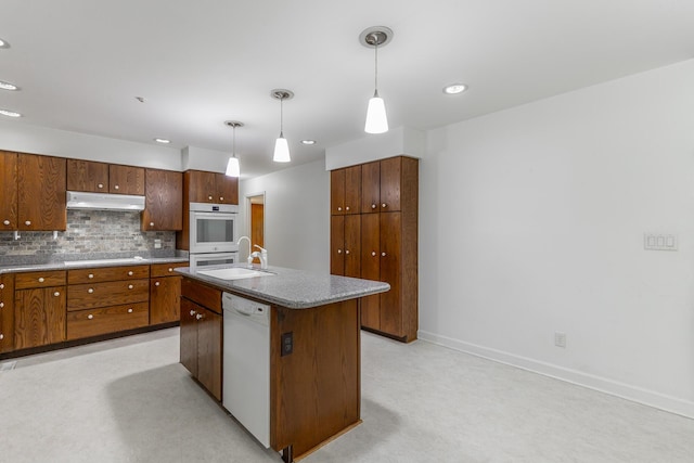 2046 N Concord Rd, Chattanooga, TN 37421 - kitchen featuring white appliances, under cabinet range hood, backsplash, pendant lighting, and recessed lighting