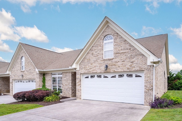 6239 Jacq Ct Unit 57, Hixson, TN 37343 - traditional-style house with concrete driveway, a shingled roof, and brick siding