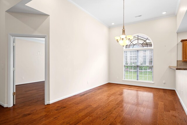 6239 Jacq Ct Unit 57, Hixson, TN 37343 - unfurnished dining area featuring a chandelier, wood finished floors, crown molding, and recessed lighting