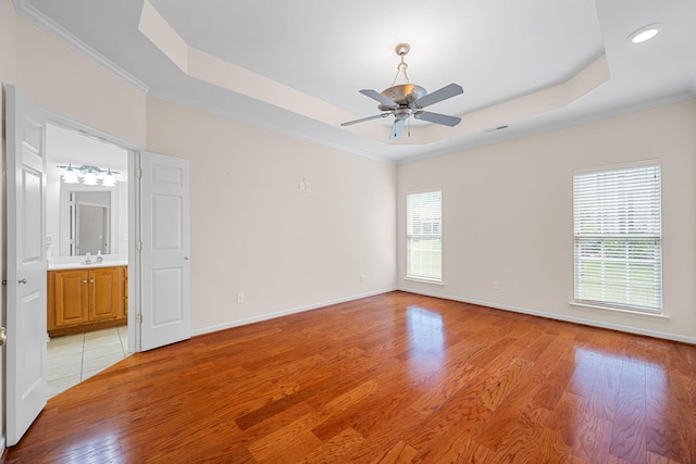 6239 Jacq Ct Unit 57, Hixson, TN 37343 - empty room with a tray ceiling, light wood-type flooring, ornamental molding, a ceiling fan, and recessed lighting